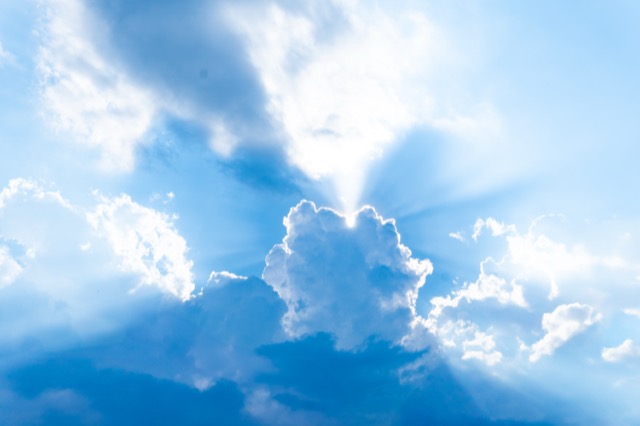 Spiritual sky with sun rays through clouds